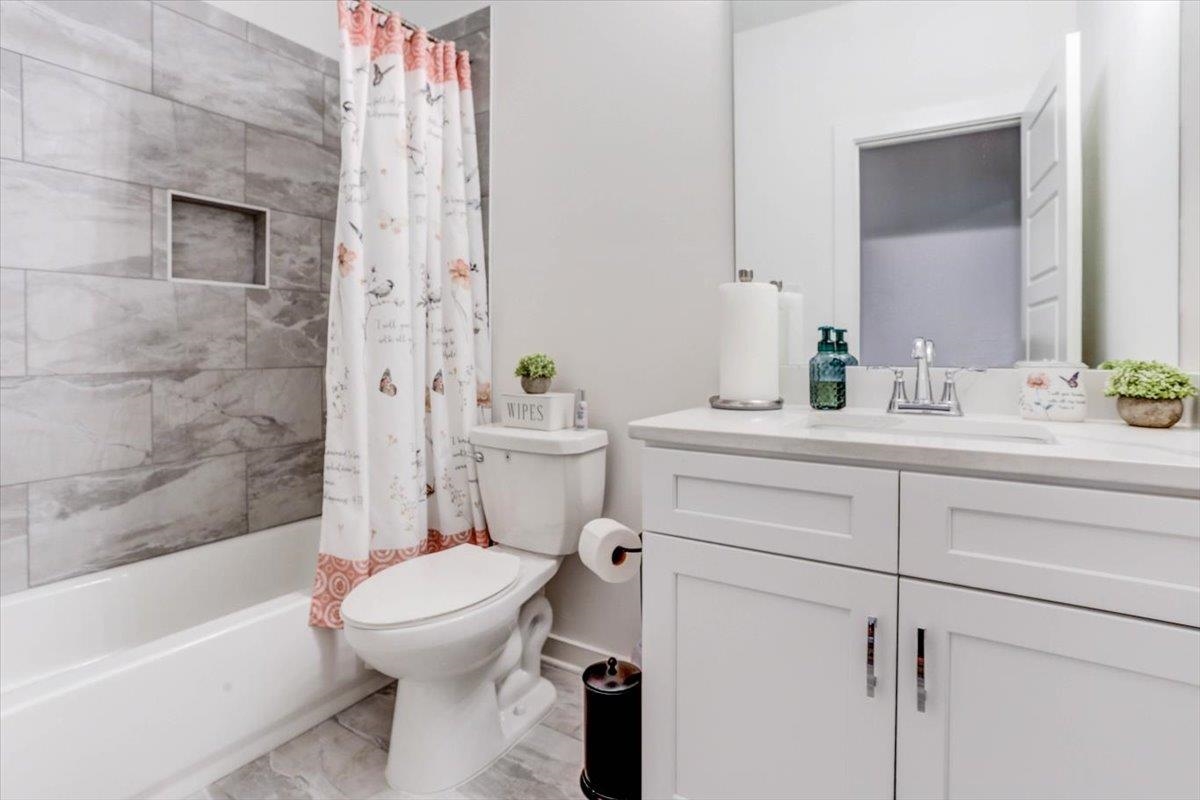 810 Mebane Road Oakland, TN 38060 - Photo 15 of 27 a bathroom with a sink a toilet and shower