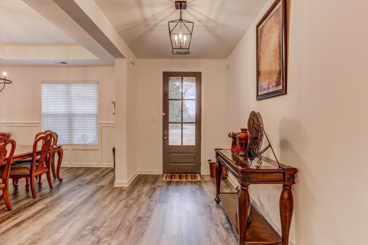 810 Mebane Road Oakland, TN 38060 - Photo 3 of 27 a view of a dining room with furniture and wooden floor
