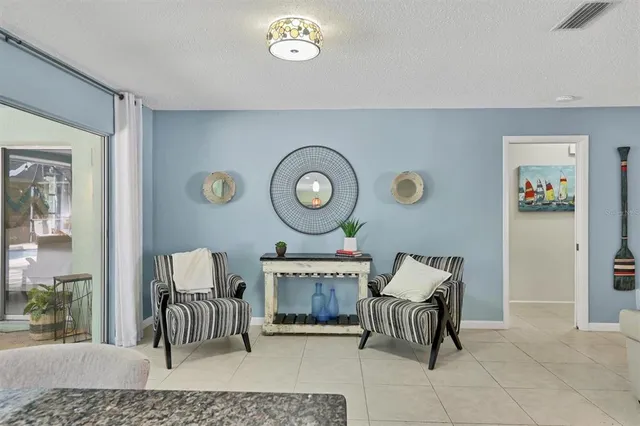 a living room with furniture and a clock