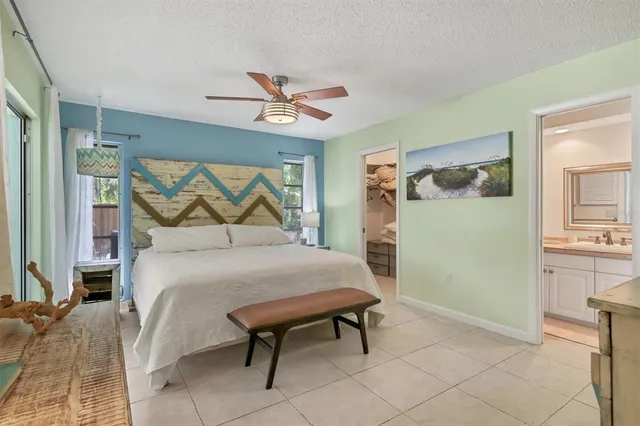 a bedroom with a bed and a table in it