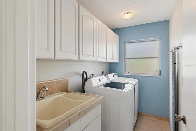 a bathroom with a sink and a window
