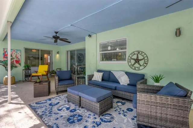a living room with furniture and a clock