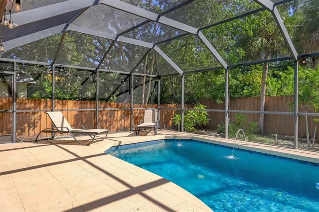 a view of a swimming pool with a patio