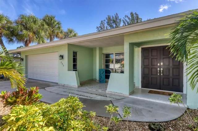 a view of a house with a small yard
