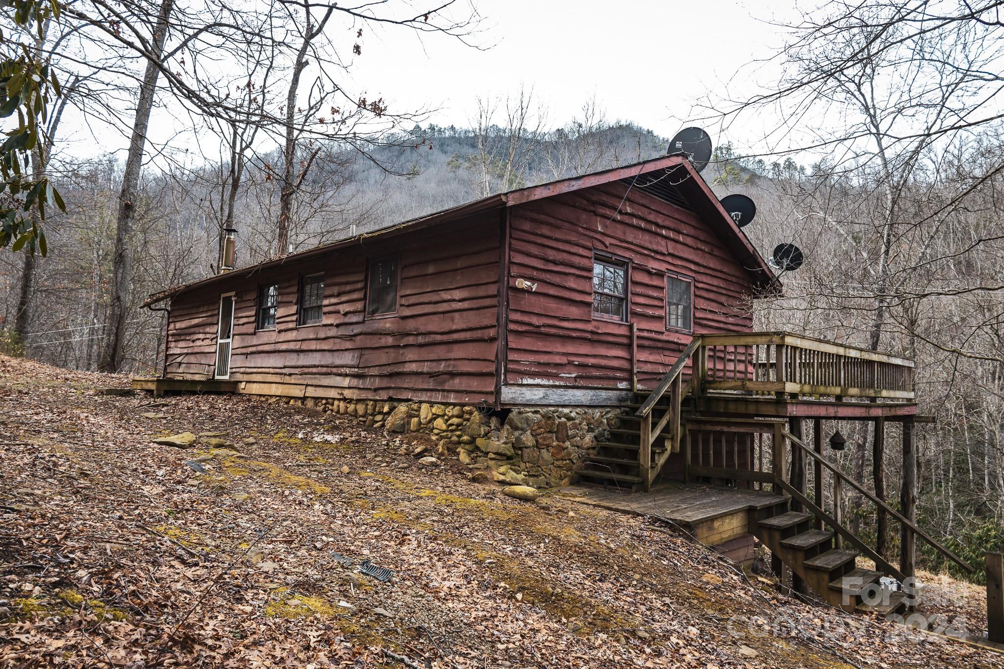 30 Panther Branch Road Canton, NC 28716 - Photo 1 of 13 a view of a house with a roof deck