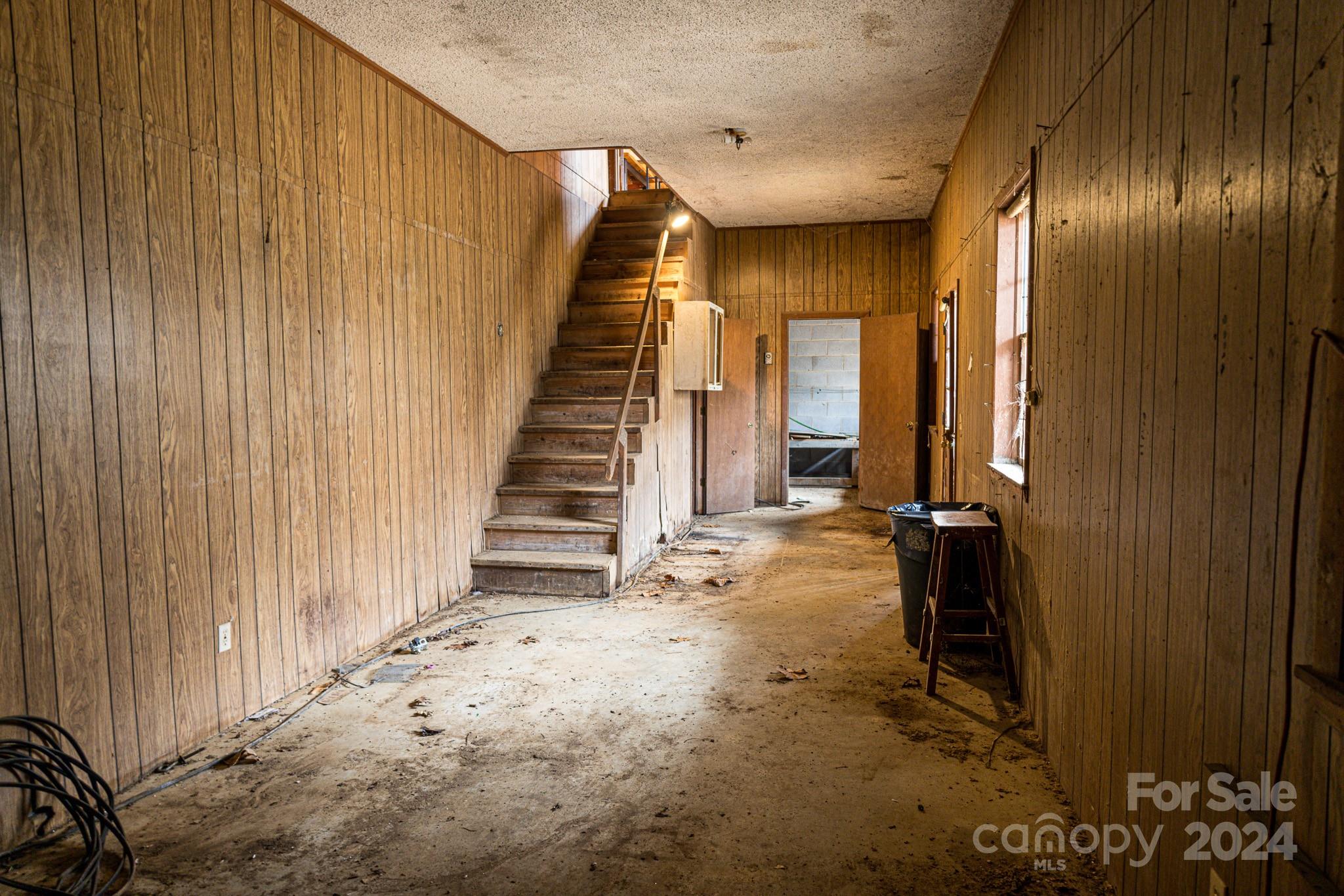 30 Panther Branch Road Canton, NC 28716 - Photo 11 of 13 a view of a livingroom with wooden floor and stairs