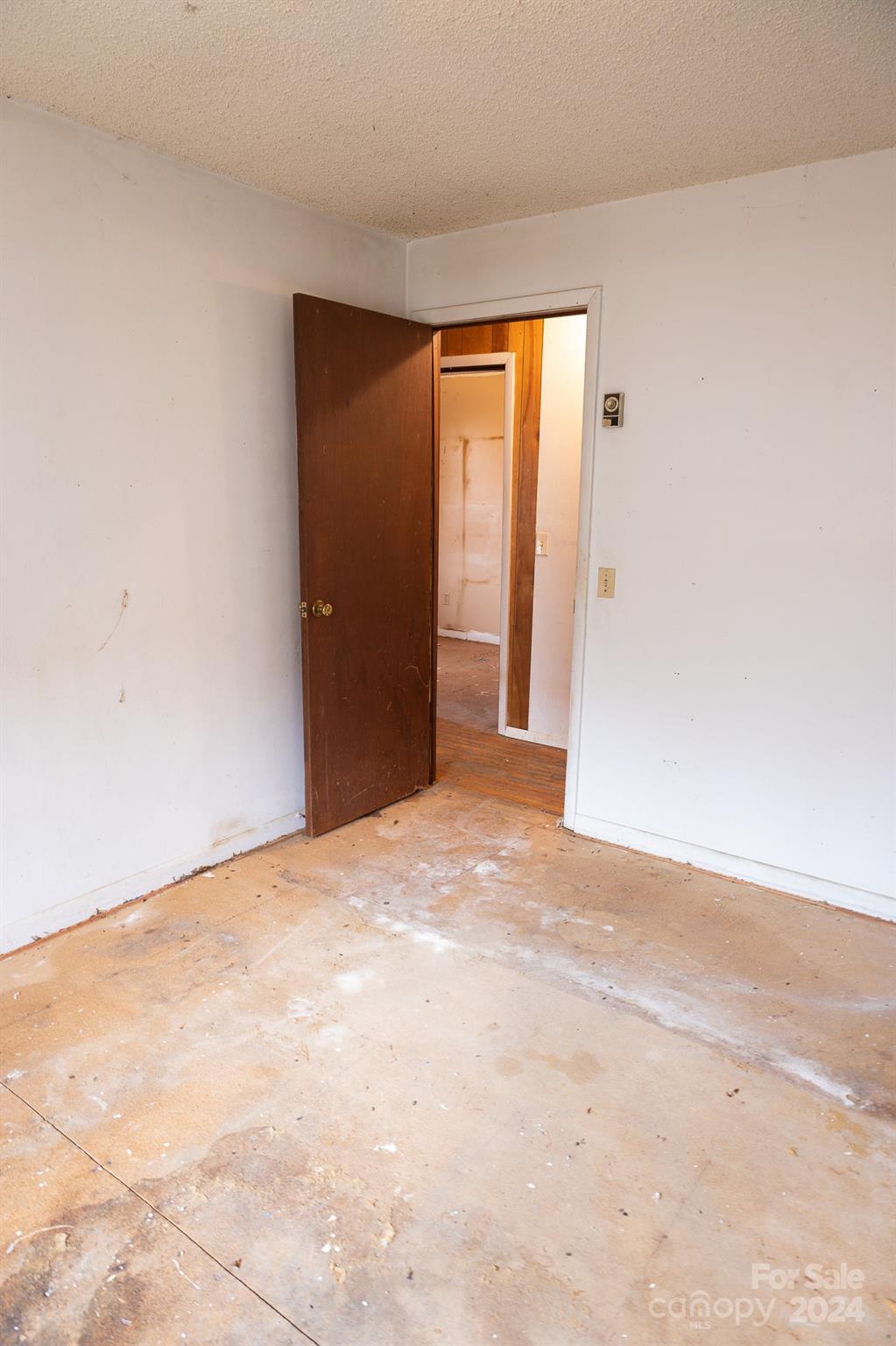 30 Panther Branch Road Canton, NC 28716 - Photo 8 of 13 a view of an empty room with wooden floor and closet