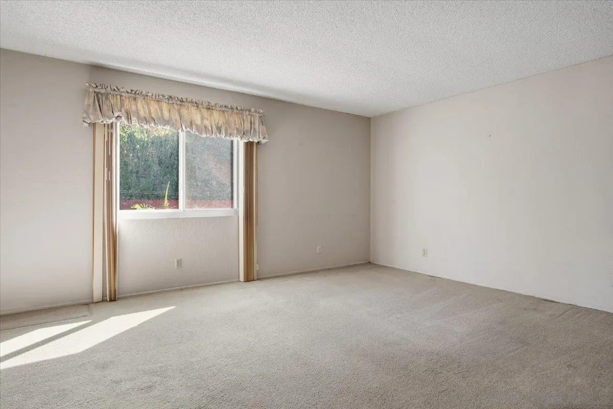 3711 Racine Road San Diego, CA 92115 - Photo 17 of 44 an empty room with a window