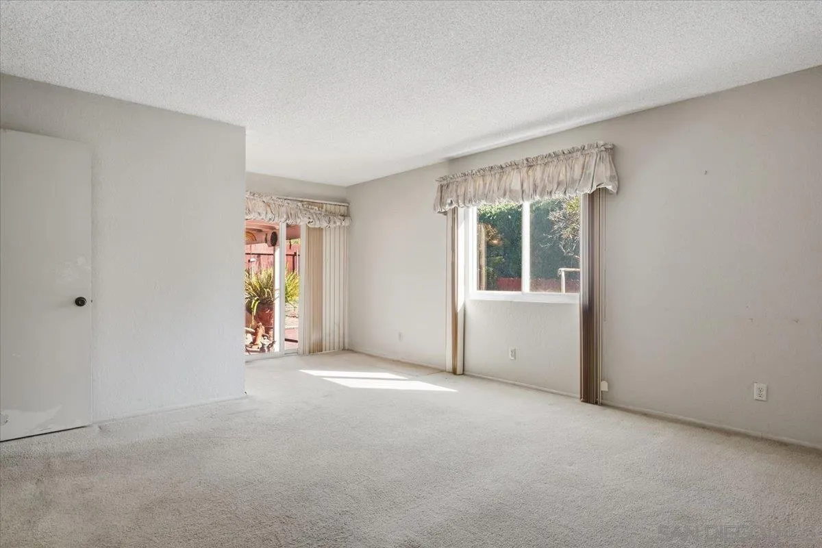 3711 Racine Road San Diego, CA 92115 - Photo 18 of 44 an empty room with windows