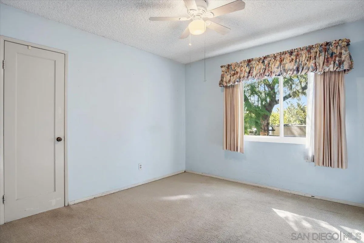 3711 Racine Road San Diego, CA 92115 - Photo 4 of 44 a view of an empty room with a window