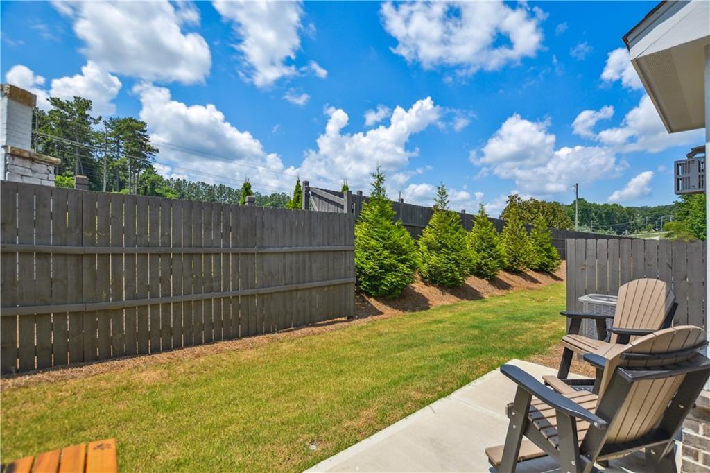 765 Trevett Way Marietta, GA 30066 - Photo 13 of 44 a view of a backyard with a garden and outdoor seating