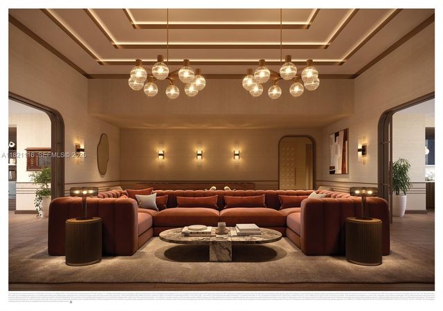 a living room with couch and a chandelier