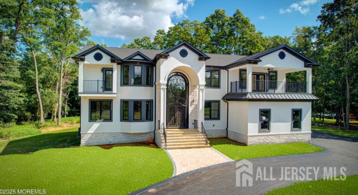 169 A Applegarth Road, Unit A Monroe Township, NJ 08831 - Photo 9 of 9 a front view of a house with garden