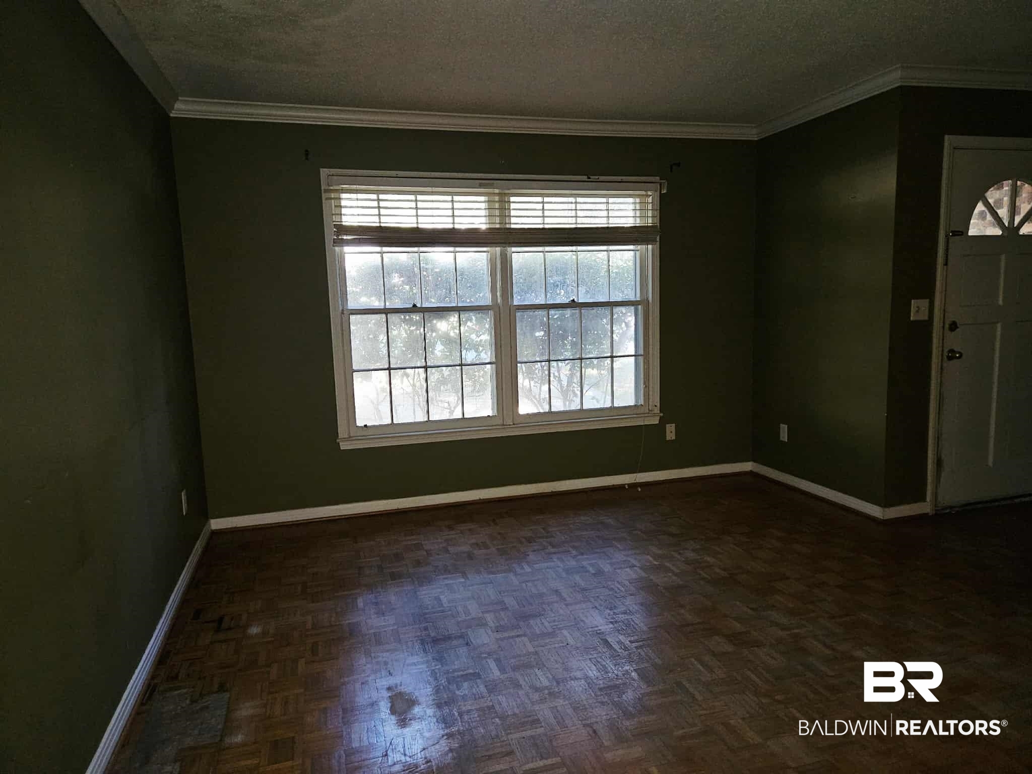 324 Vanderbilt Drive Mobile, AL 36608 - Photo 11 of 17 Entryway featuring crown molding and a textured ceiling