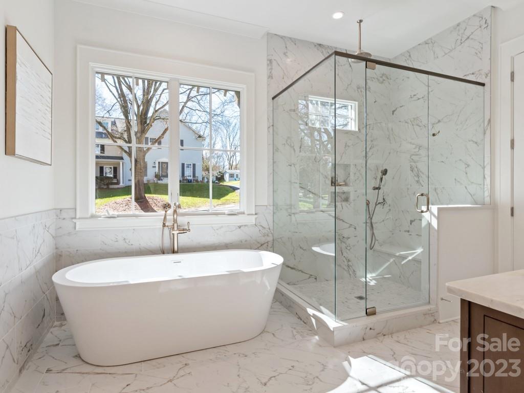 3002 Ferncliff Road Charlotte, NC 28211 - Photo 35 of 44 a white bath tub sitting next to a shower