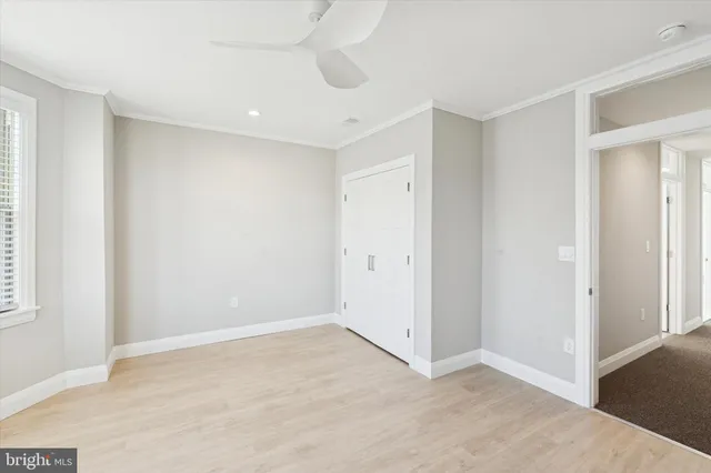 a view of empty room with white walls