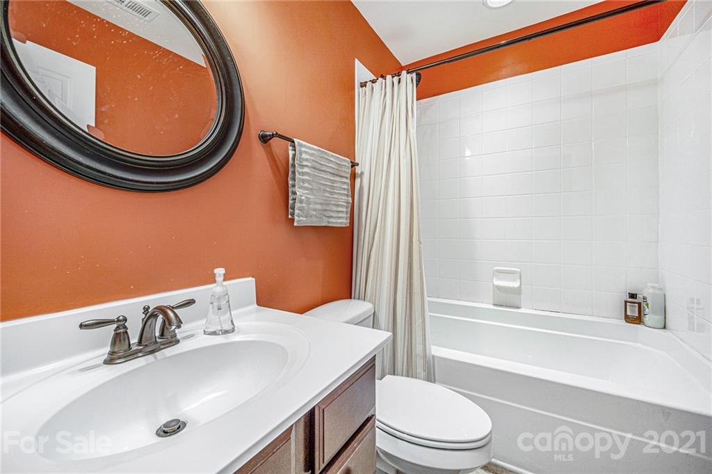 7678 West Berkeley Road Denver, NC 28037 - Photo 17 of 29 a bathroom with a sink a toilet and a mirror