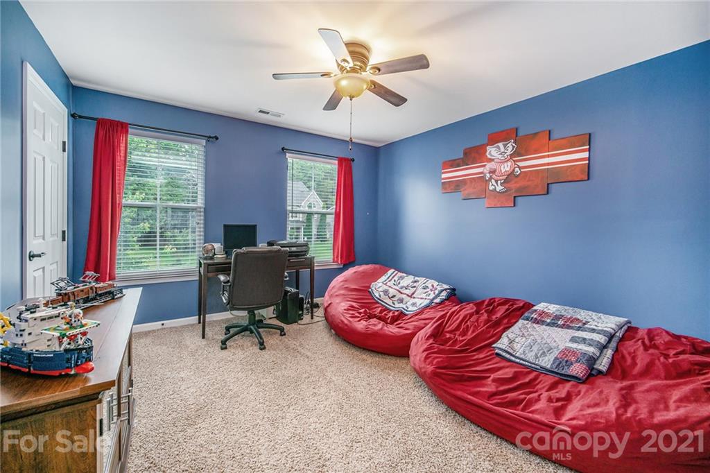 7678 West Berkeley Road Denver, NC 28037 - Photo 18 of 29 a bedroom with furniture and a window
