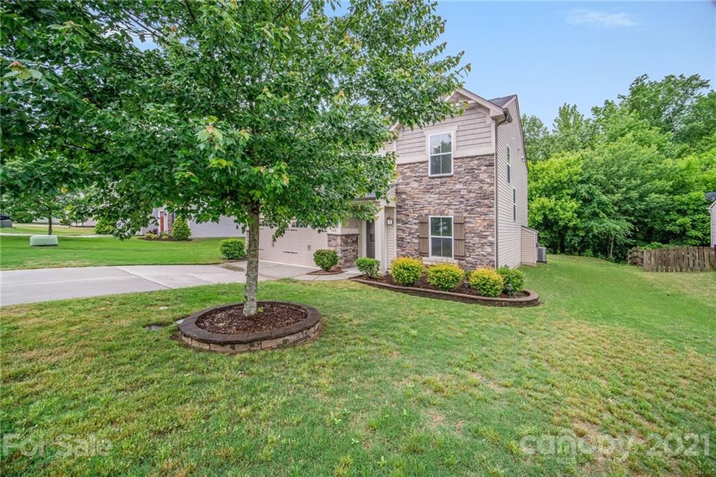 7678 West Berkeley Road Denver, NC 28037 - Photo 3 of 29 a front view of a house with a yard