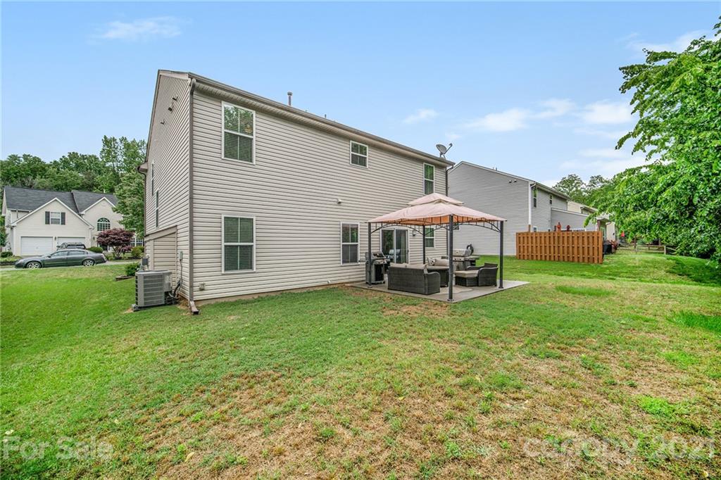 7678 West Berkeley Road Denver, NC 28037 - Photo 27 of 29 a view of a house with a yard