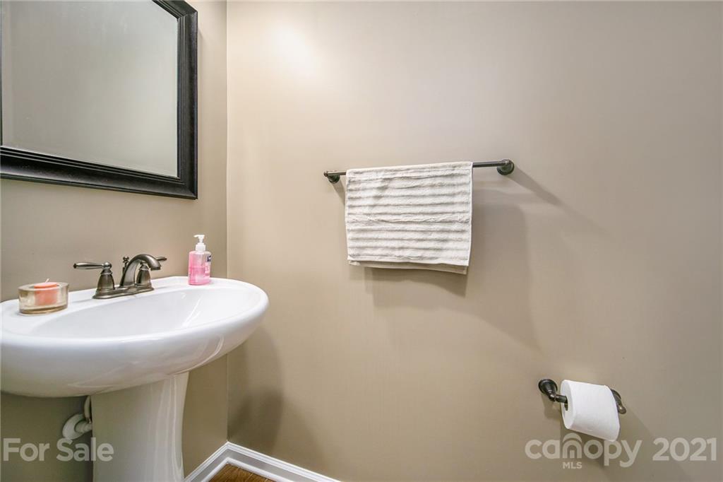 7678 West Berkeley Road Denver, NC 28037 - Photo 6 of 29 a bathroom with a sink a mirror and a toilet