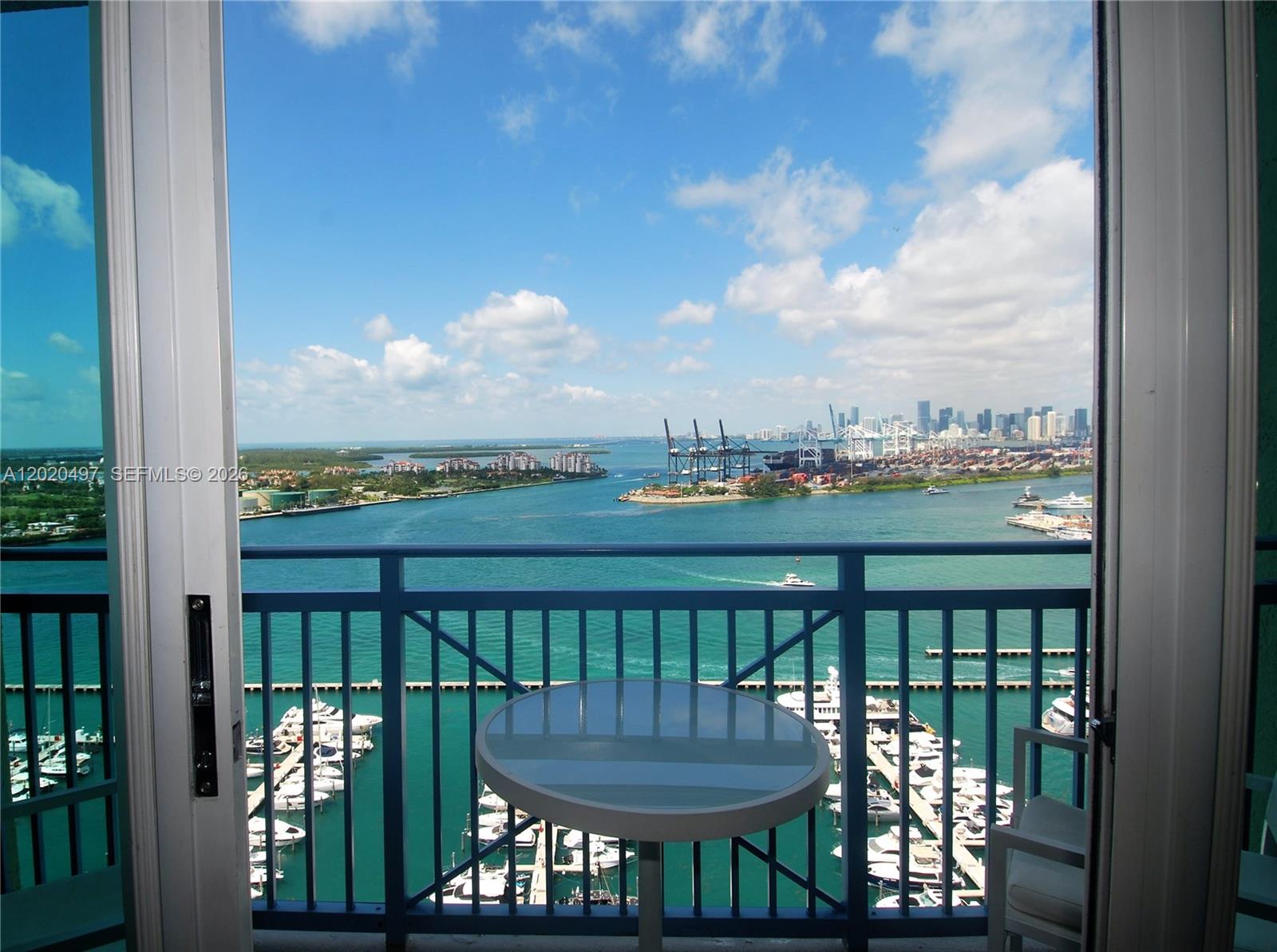 a view of a balcony with furniture