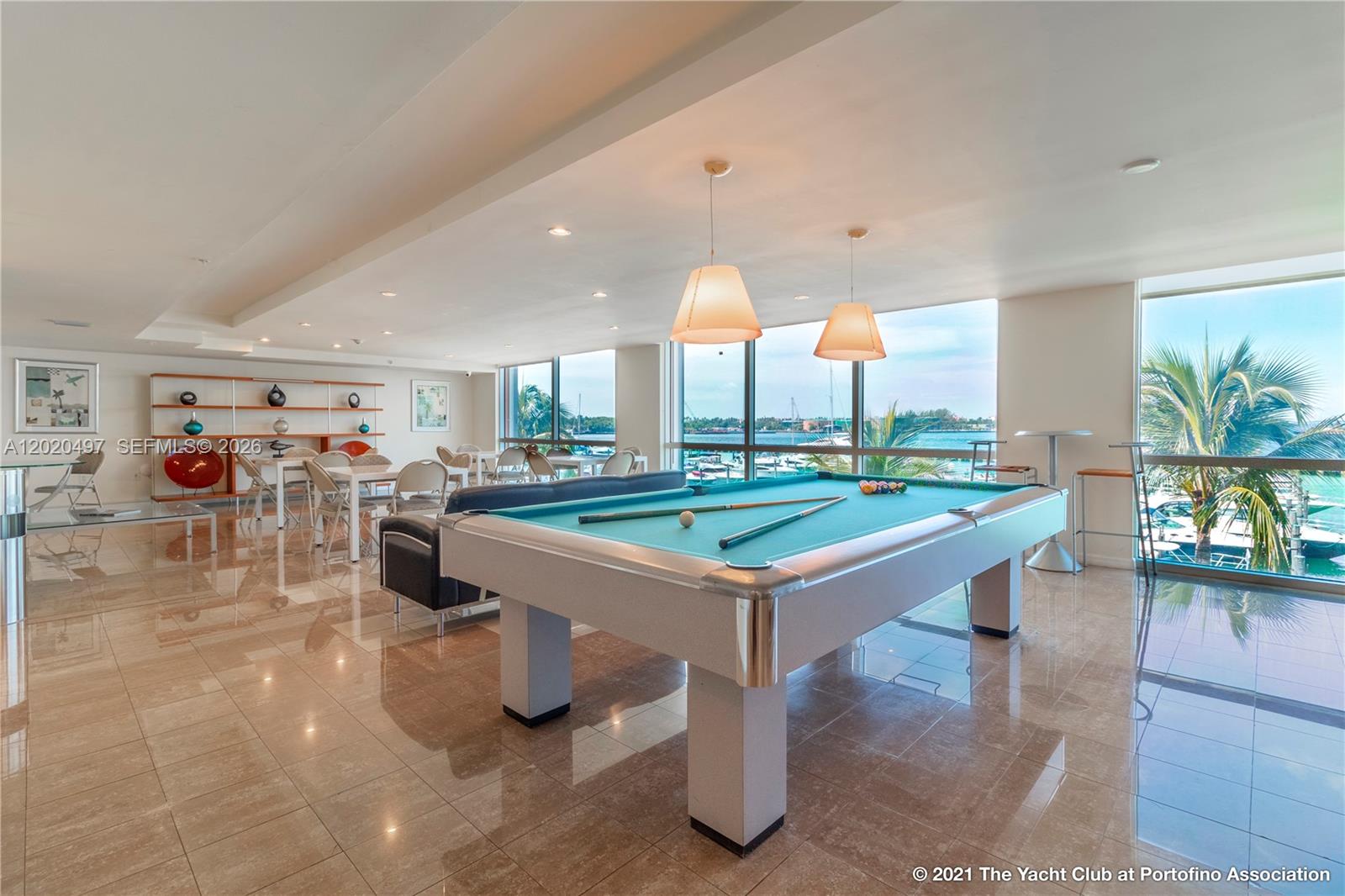 90 Alton Road, Unit 2708 Miami Beach, FL 33139 - Photo 7 of 10 a room with lots of furniture and white walls