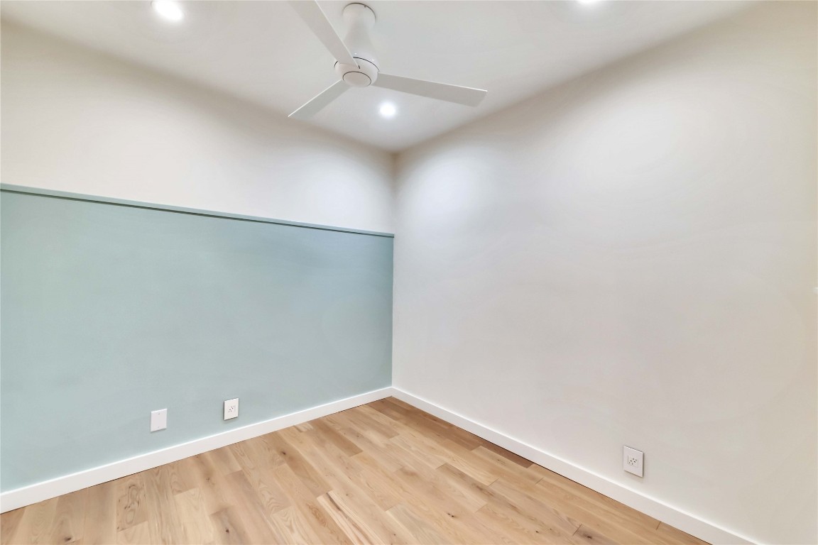 2020 South Congress Avenue, Unit 1224 Austin, TX 78704 - Photo 13 of 26 a view of an empty room with wooden floor