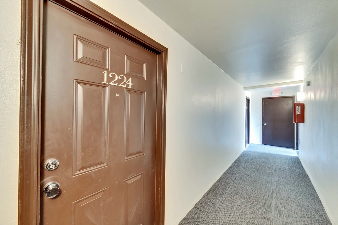 2020 South Congress Avenue, Unit 1224 Austin, TX 78704 - Photo 26 of 26 a view of a hallway with wooden shelves