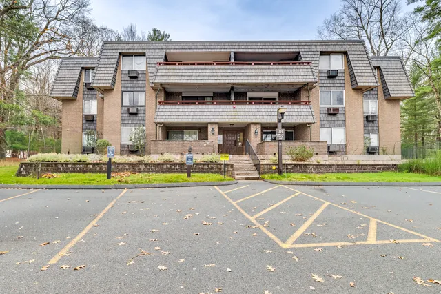 a view of a building with a swimming pool