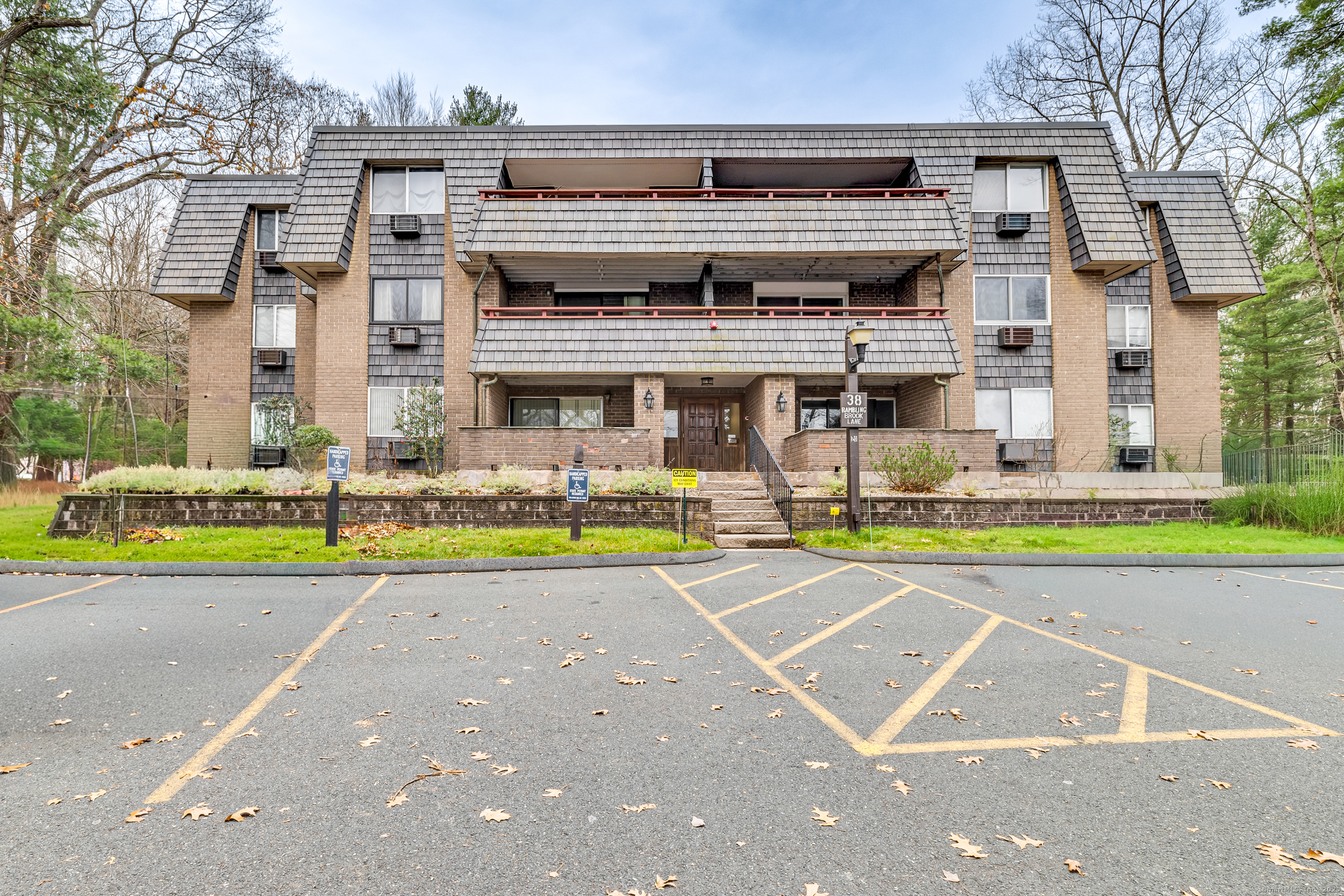 38 Rambling Brook Lane, Unit A2 Glastonbury, CT 06033 - Photo 1 of 23 a view of a building with a swimming pool