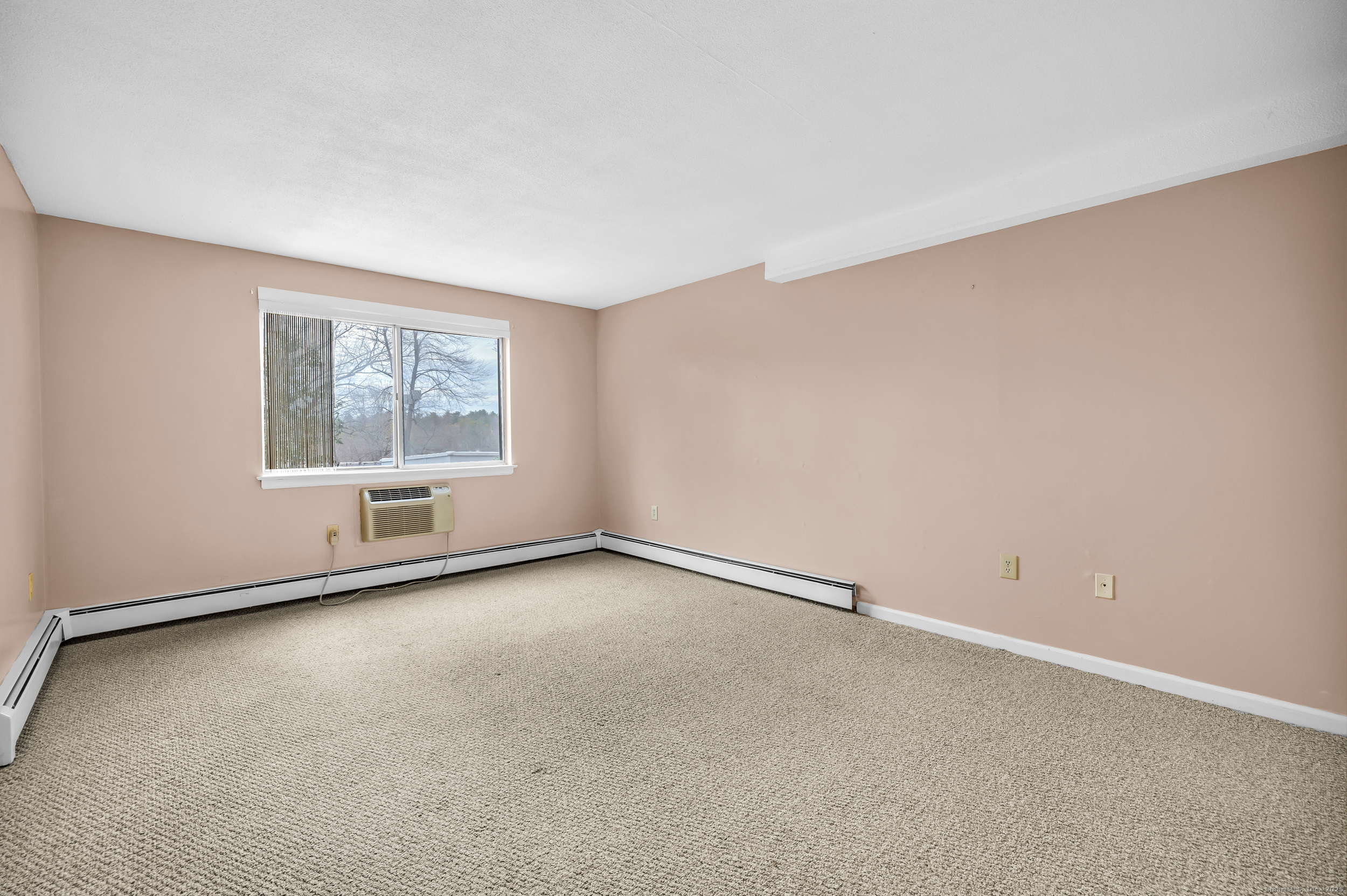 38 Rambling Brook Lane, Unit A2 Glastonbury, CT 06033 - Photo 11 of 23 an empty room with windows