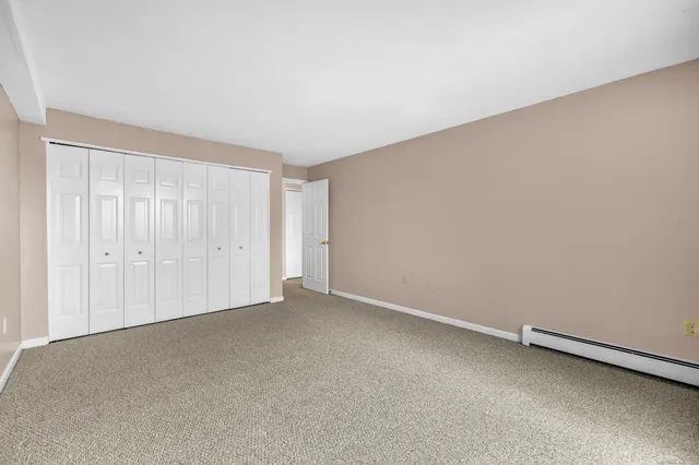an empty room with closet area