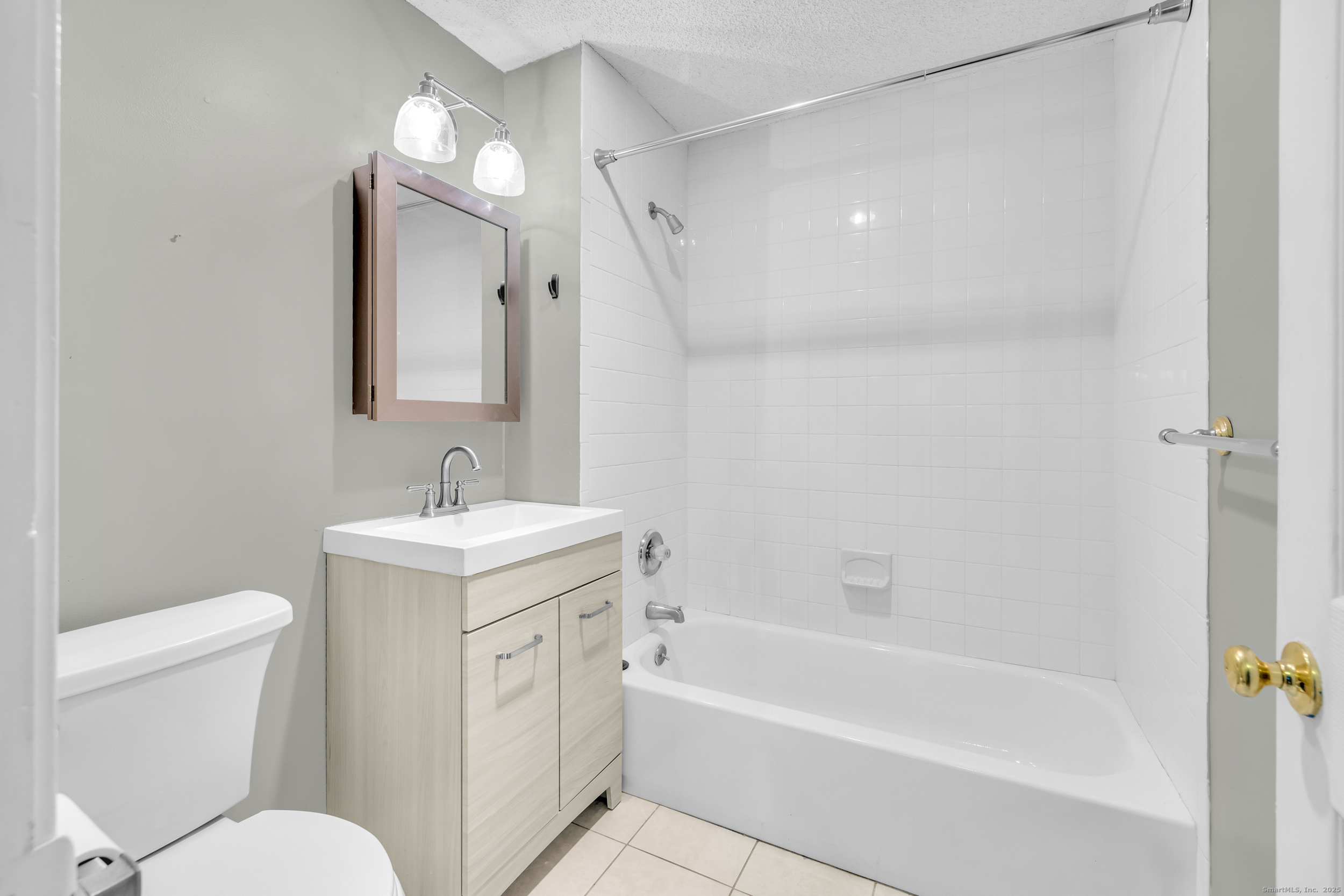 38 Rambling Brook Lane, Unit A2 Glastonbury, CT 06033 - Photo 14 of 23 a bathroom with a sink a toilet and shower