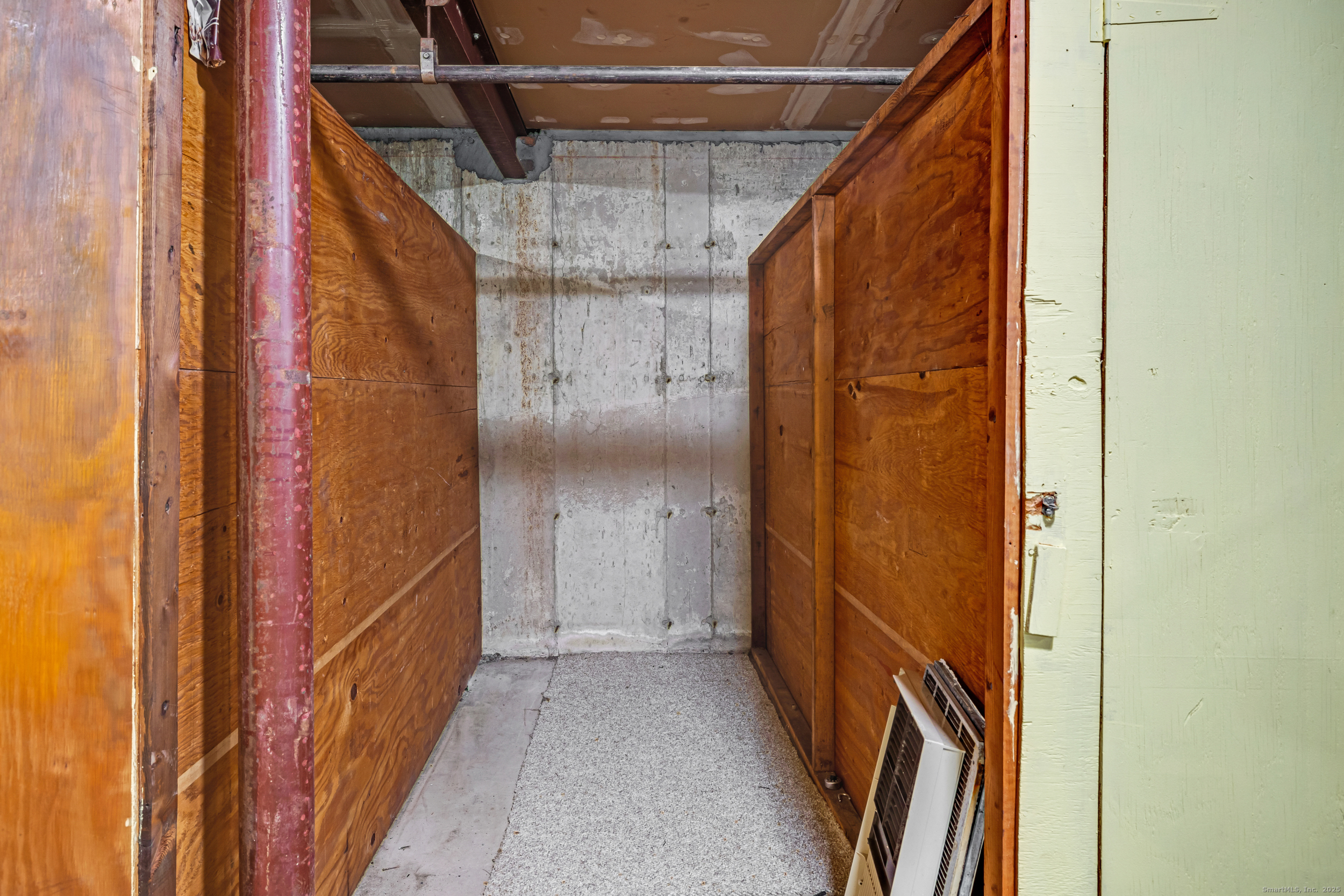 38 Rambling Brook Lane, Unit A2 Glastonbury, CT 06033 - Photo 18 of 23 a view of a door with wooden floor and door