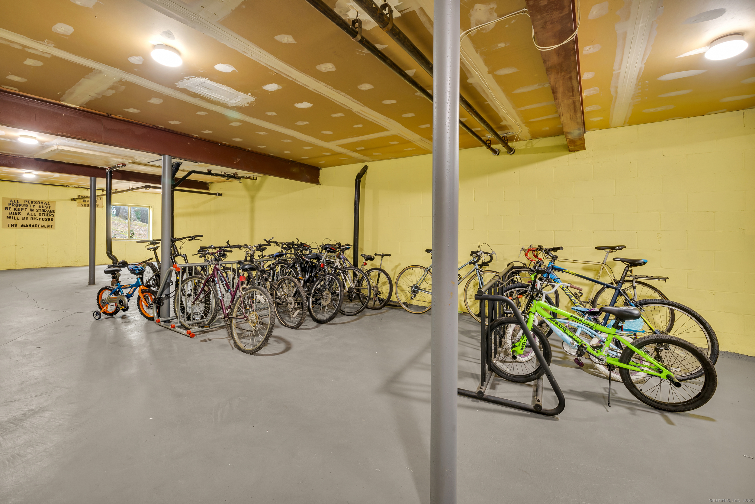 38 Rambling Brook Lane, Unit A2 Glastonbury, CT 06033 - Photo 19 of 23 a view of a room with gym equipment