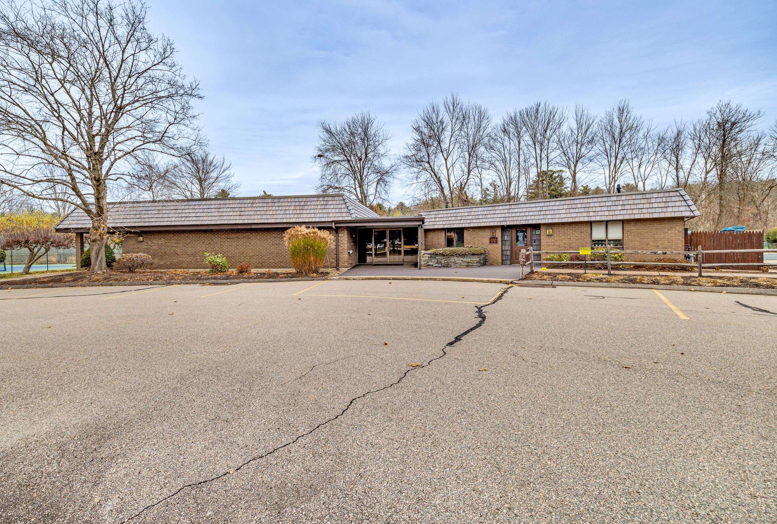 38 Rambling Brook Lane, Unit A2 Glastonbury, CT 06033 - Photo 20 of 23 a view of large building with large trees
