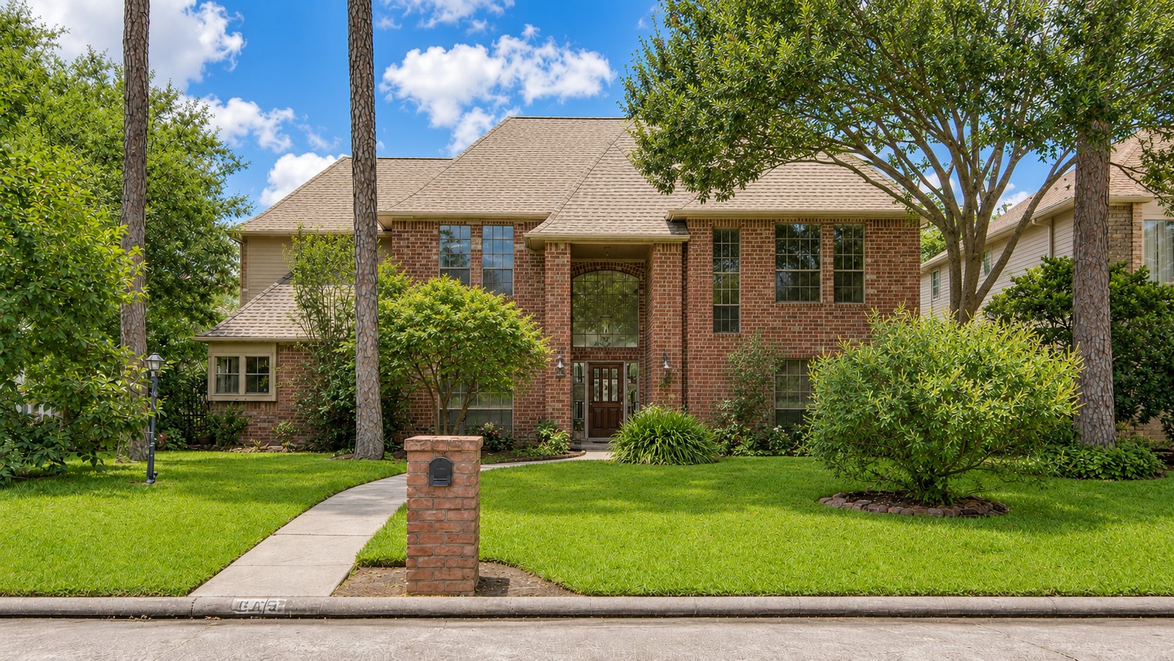 8412 Hidden Trail Lane Spring, TX 77379 - Photo 3 of 38 A view of the front façade highlights the mature trees and inviting approach to this well-maintained home with pool and spa.