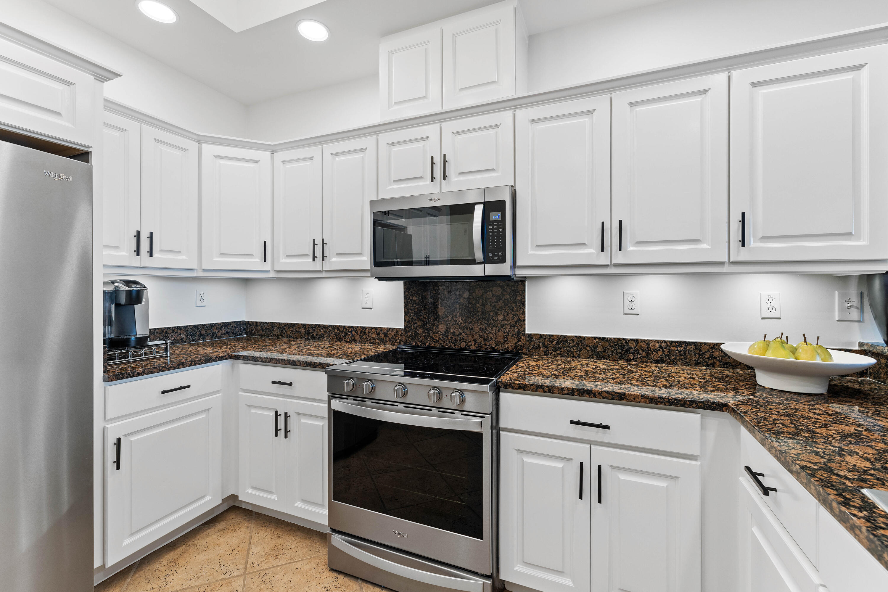 9961 East County Highway 30A, Unit 205 Inlet Beach, FL 32461 - Photo 14 of 45 a kitchen with granite countertop white cabinets and stainless steel appliances