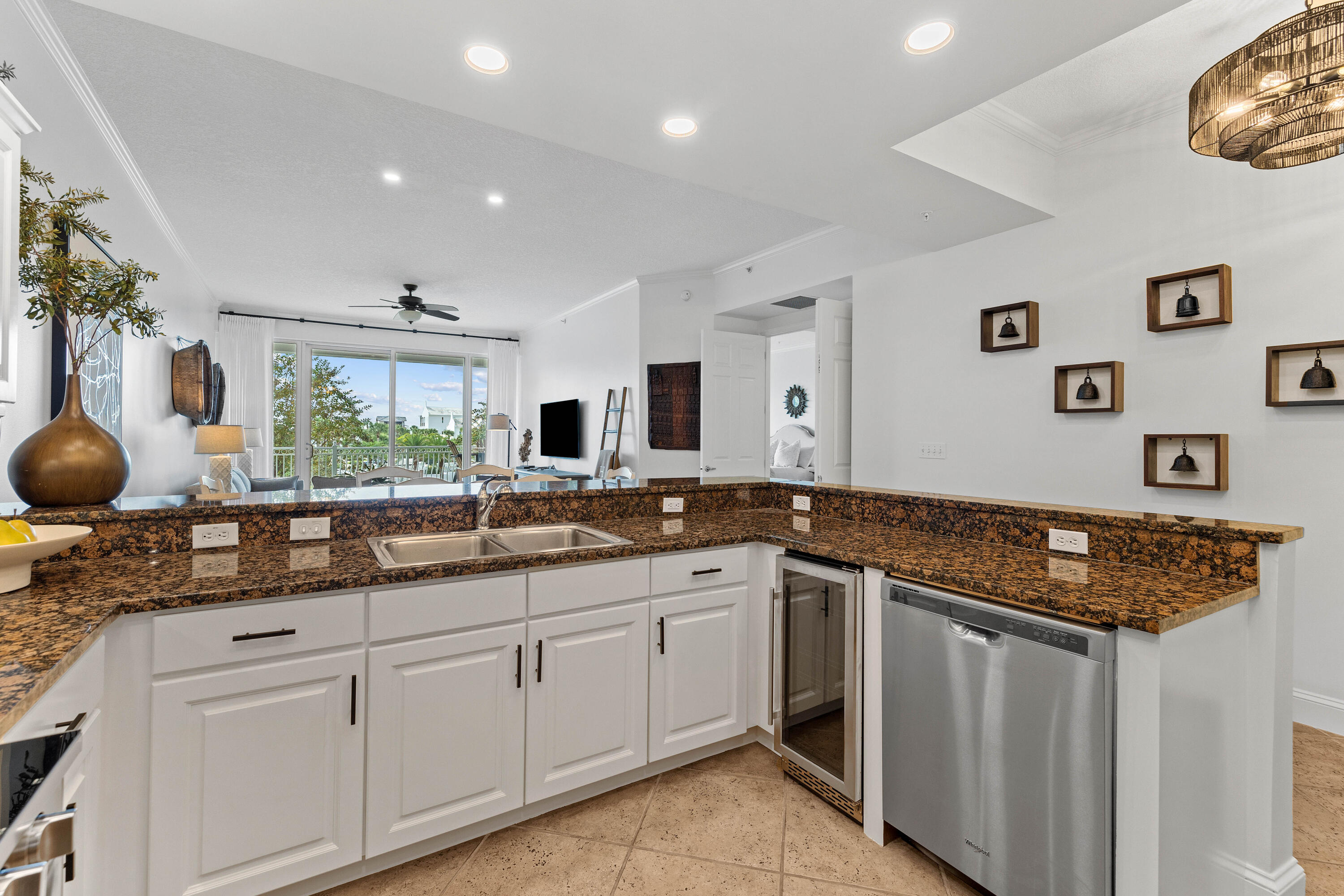 9961 East County Highway 30A, Unit 205 Inlet Beach, FL 32461 - Photo 15 of 45 a kitchen with stainless steel appliances granite countertop a sink and cabinets