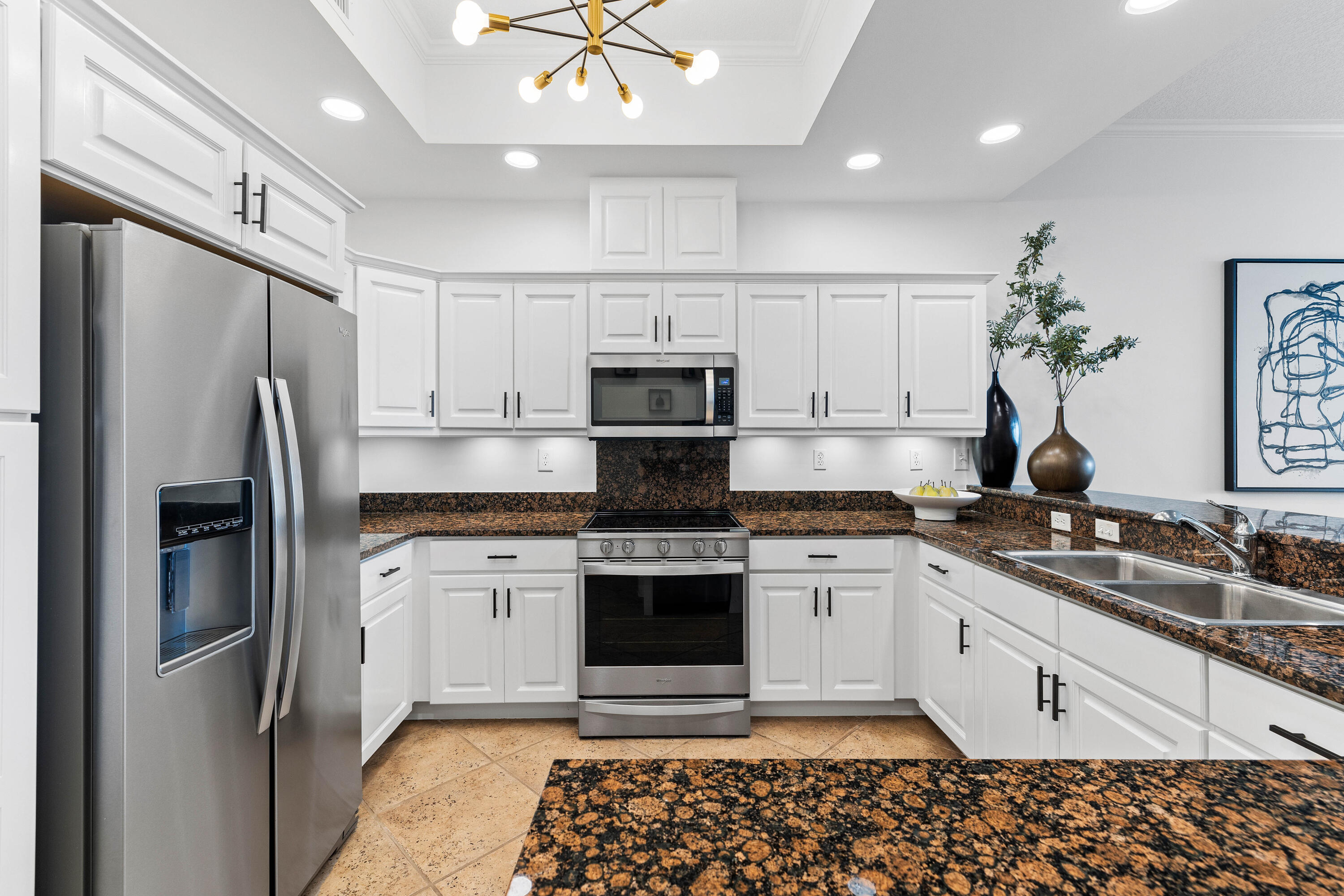9961 East County Highway 30A, Unit 205 Inlet Beach, FL 32461 - Photo 16 of 45 a kitchen with stainless steel appliances granite countertop a refrigerator a stove a sink and white cabinets