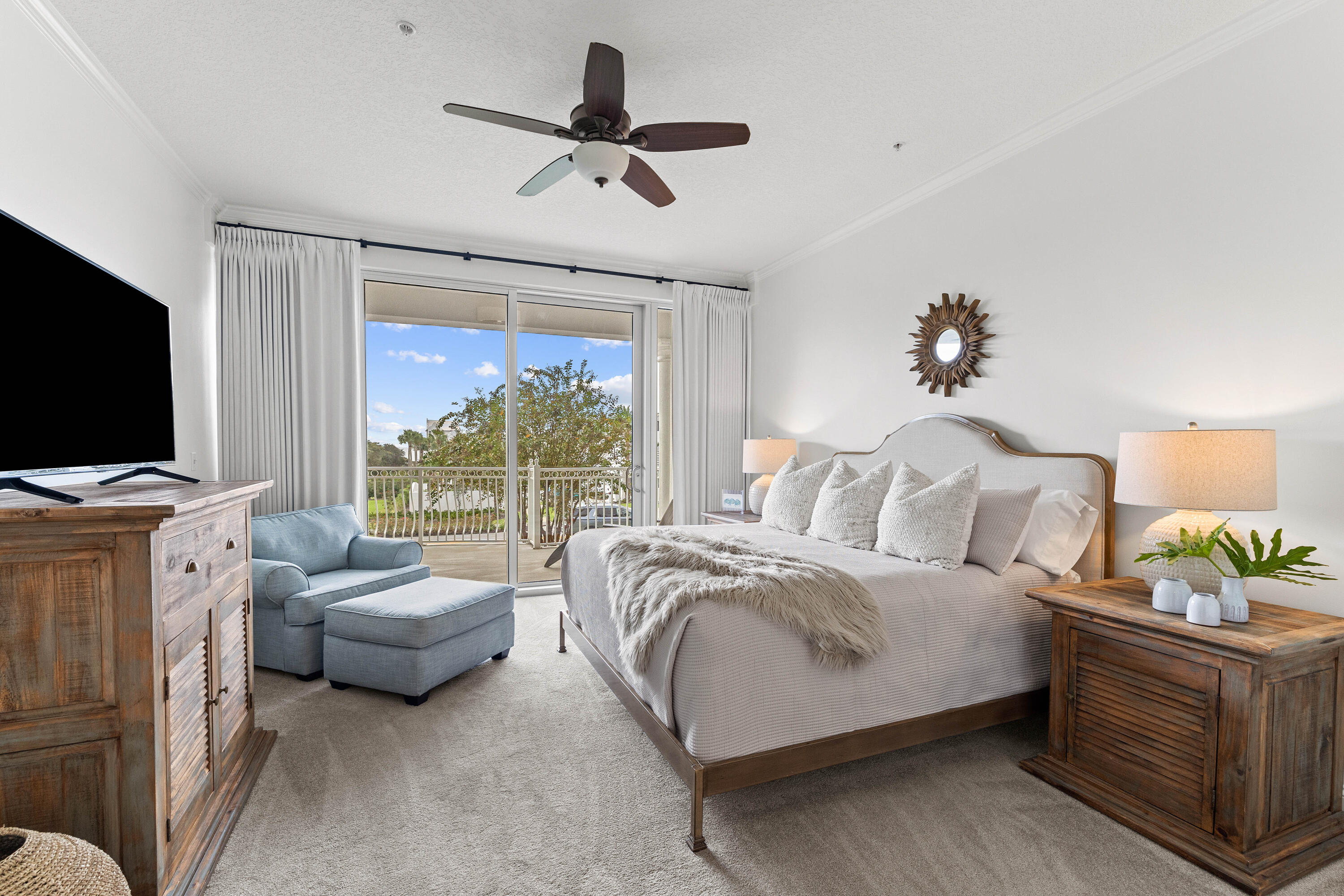 9961 East County Highway 30A, Unit 205 Inlet Beach, FL 32461 - Photo 21 of 45 a spacious bedroom with a bed and flat screen tv