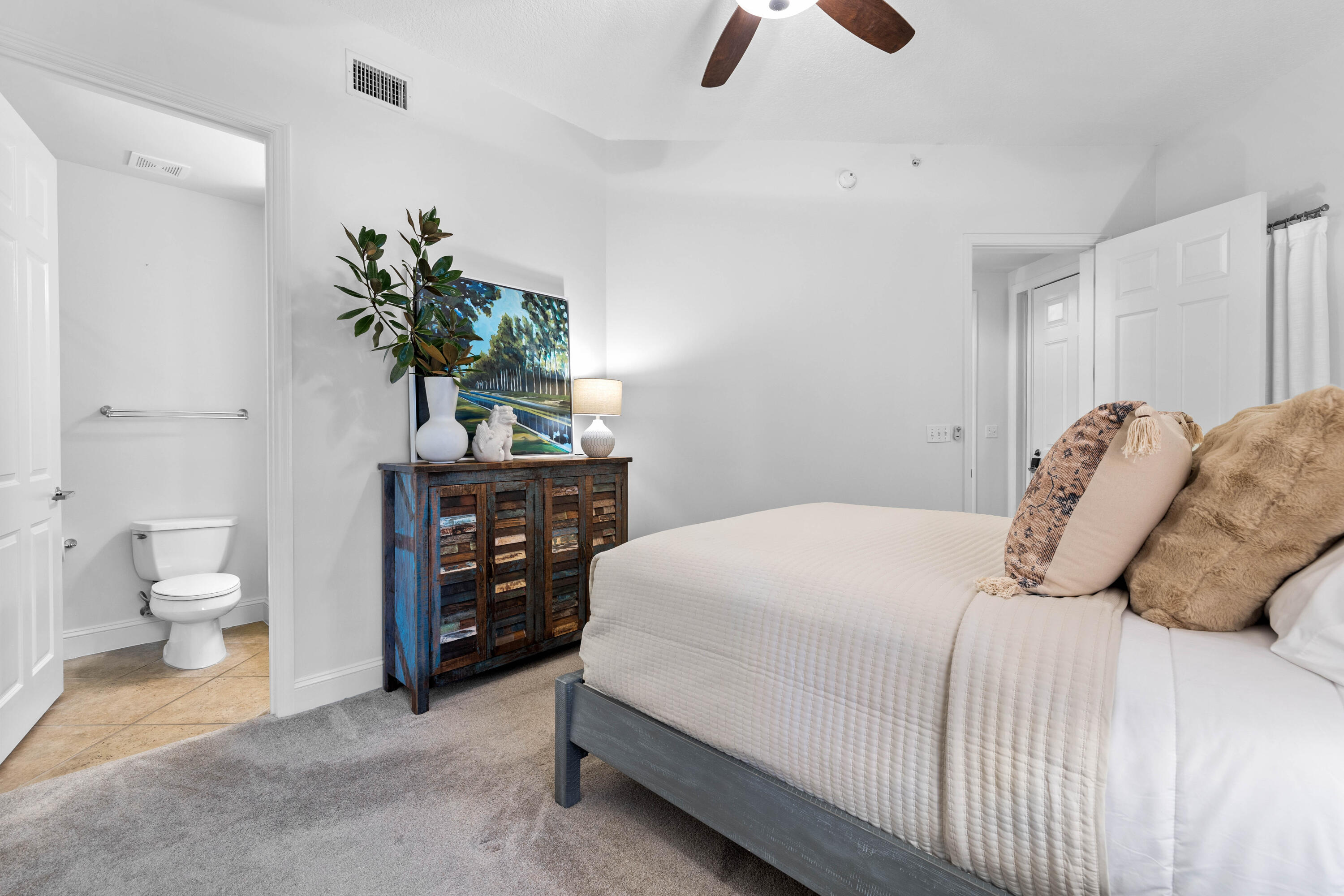 9961 East County Highway 30A, Unit 205 Inlet Beach, FL 32461 - Photo 24 of 45 a bedroom with a bed and a potted plant