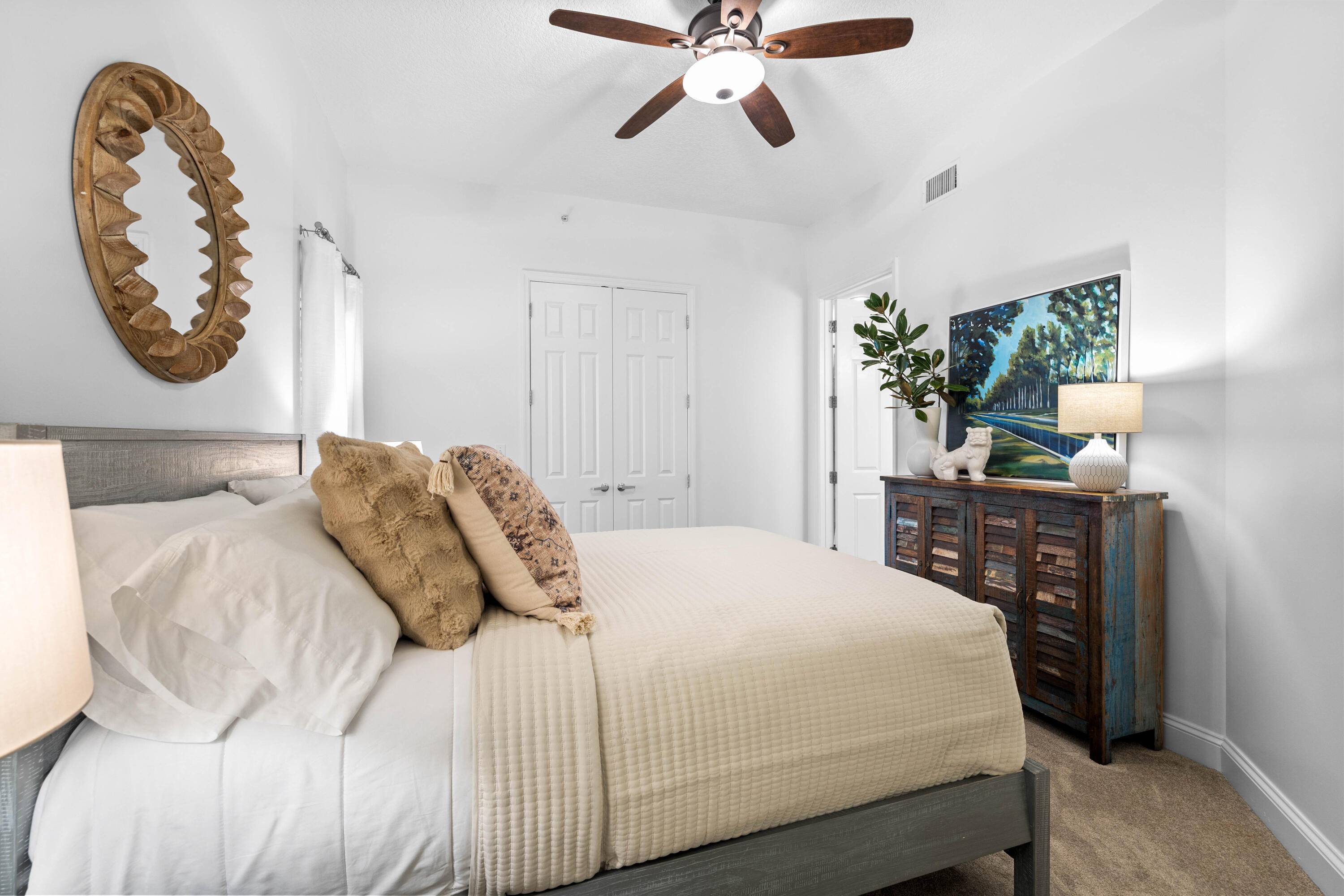 9961 East County Highway 30A, Unit 205 Inlet Beach, FL 32461 - Photo 25 of 45 a bedroom with a large bed and a chandelier