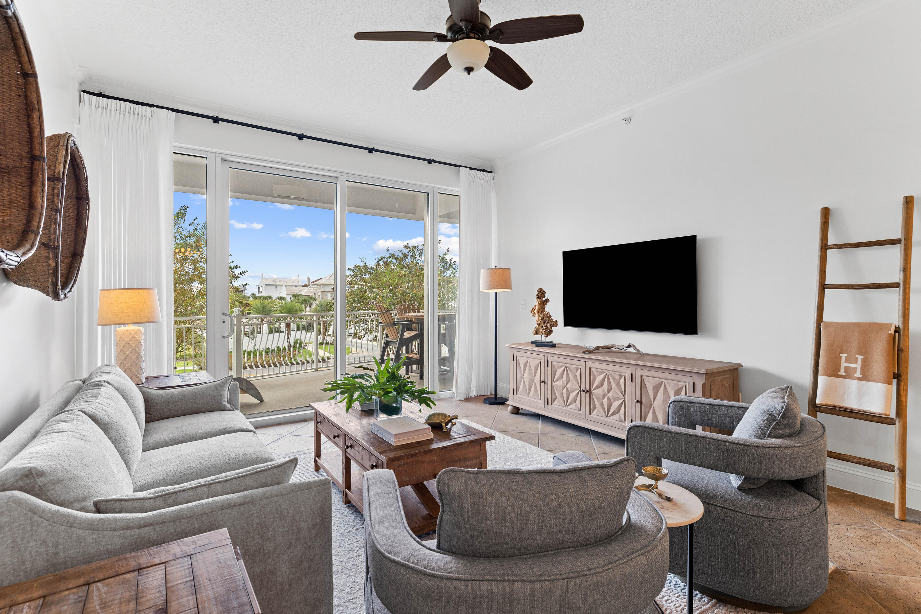 9961 East County Highway 30A, Unit 205 Inlet Beach, FL 32461 - Photo 3 of 45 a living room with furniture and a flat screen tv