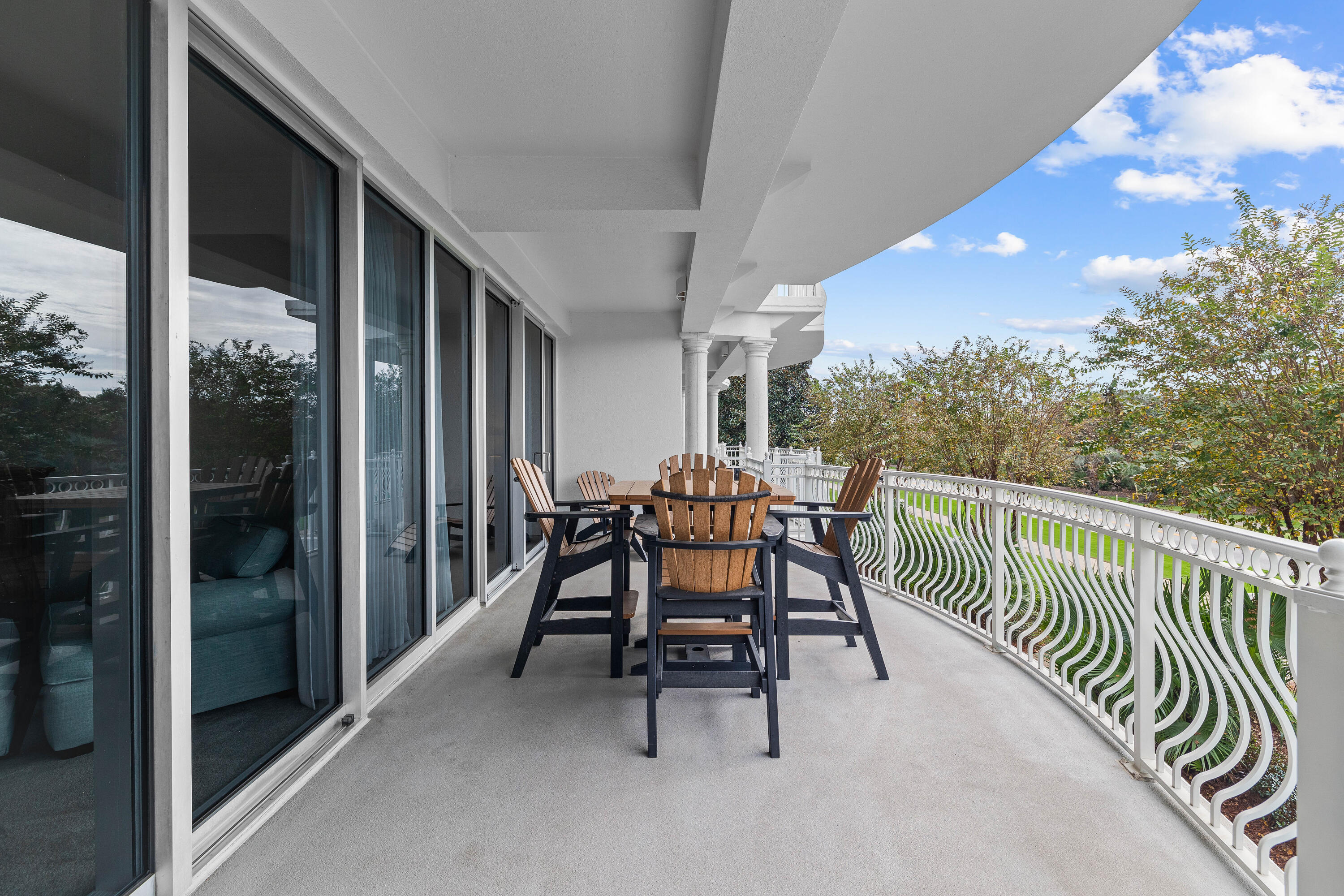 9961 East County Highway 30A, Unit 205 Inlet Beach, FL 32461 - Photo 35 of 45 a view of a porch with furniture and floor to ceiling window
