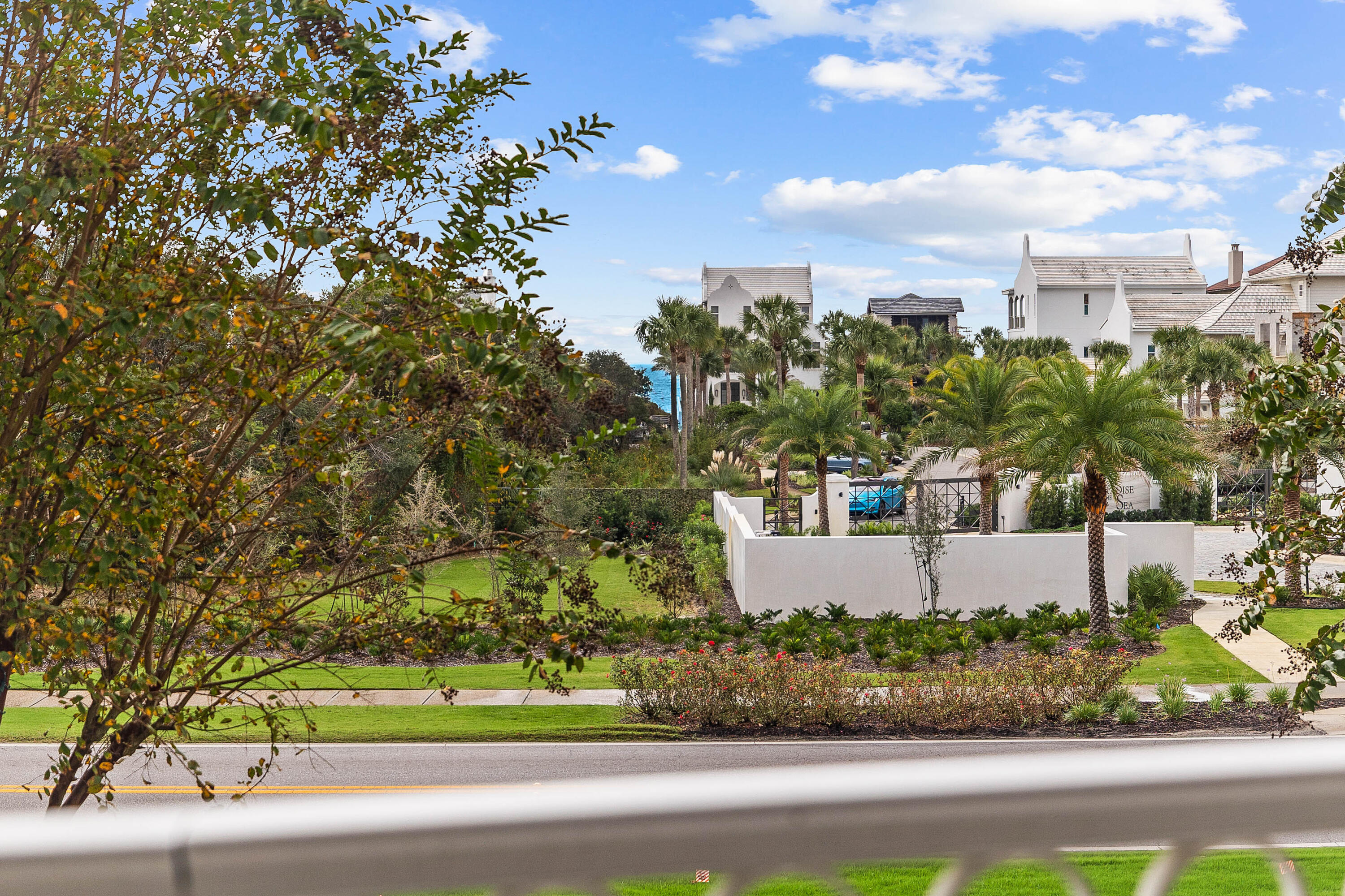 9961 East County Highway 30A, Unit 205 Inlet Beach, FL 32461 - Photo 41 of 45 an aerial view of a house with a yard and lake view