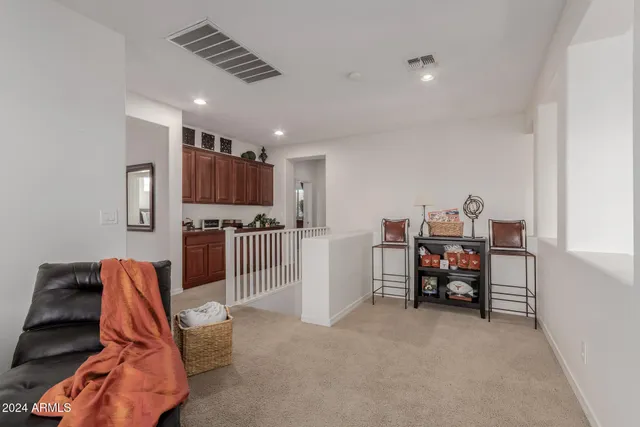 a view of living room filled with furniture and wooden floor