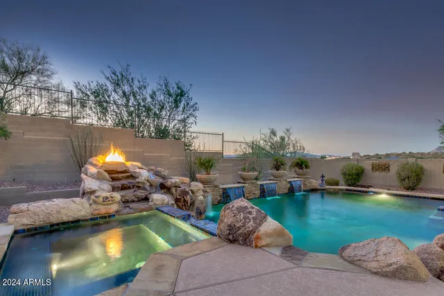 a swimming pool view with a garden space