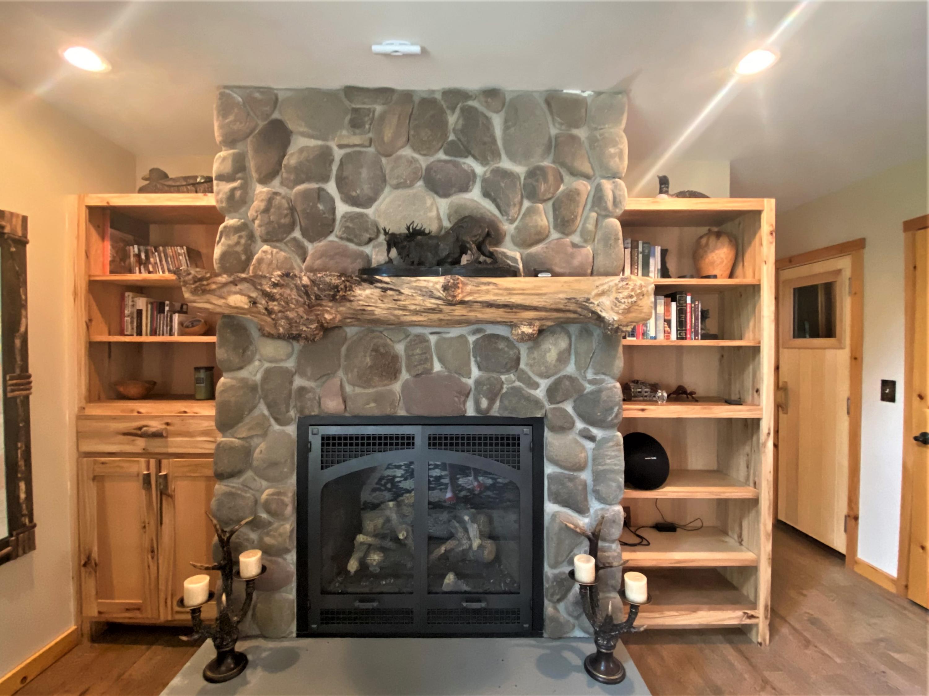 566 Springy Pond Road Otis, ME 04605 - Photo 16 of 36 Fireplace Built Ins